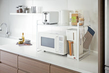 Load image into Gallery viewer, Yamazaki&#39;s white counter organizer sitting atop a microwave in a kitchen